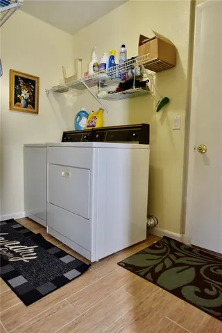 a kitchen with a refrigerator and a stove
