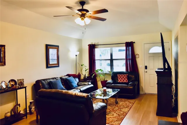 a living room with furniture and a window