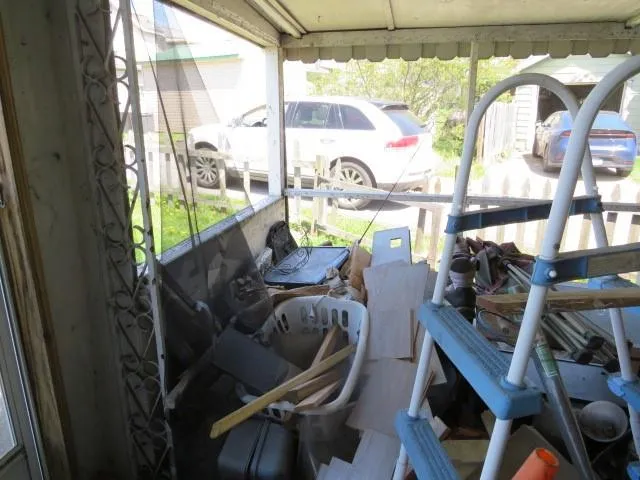 a view of a living room with furniture and a window