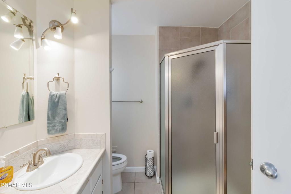 705 Wishard Avenue Simi Valley, CA 93065 - Photo 25 of 50 a bathroom with a granite countertop sink toilet and shower
