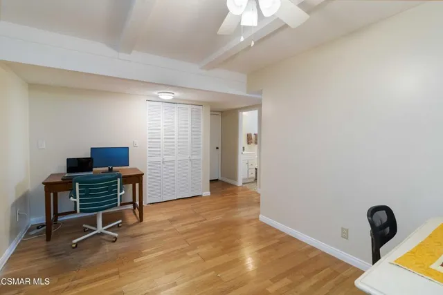 a workspace with furniture and window