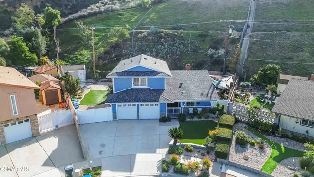 an aerial view of a house with a garden