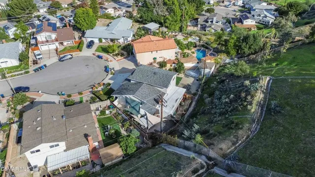 an aerial view of residential houses with outdoor space