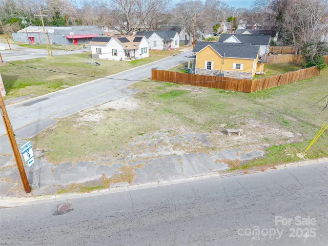 a view of a house with a yard and a garage