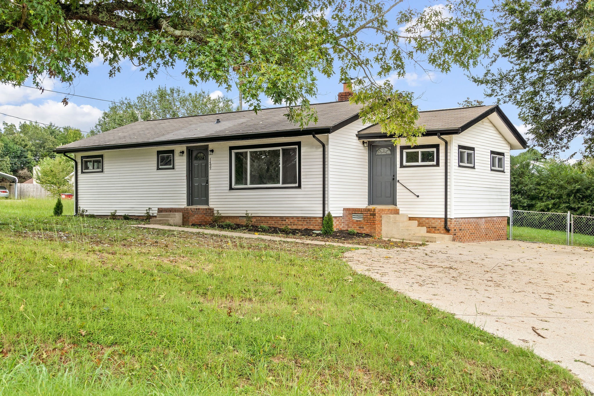1499 North Liberty Church Road Clarksville, TN 37042 - Photo 1 of 9 a front view of a house with a yard