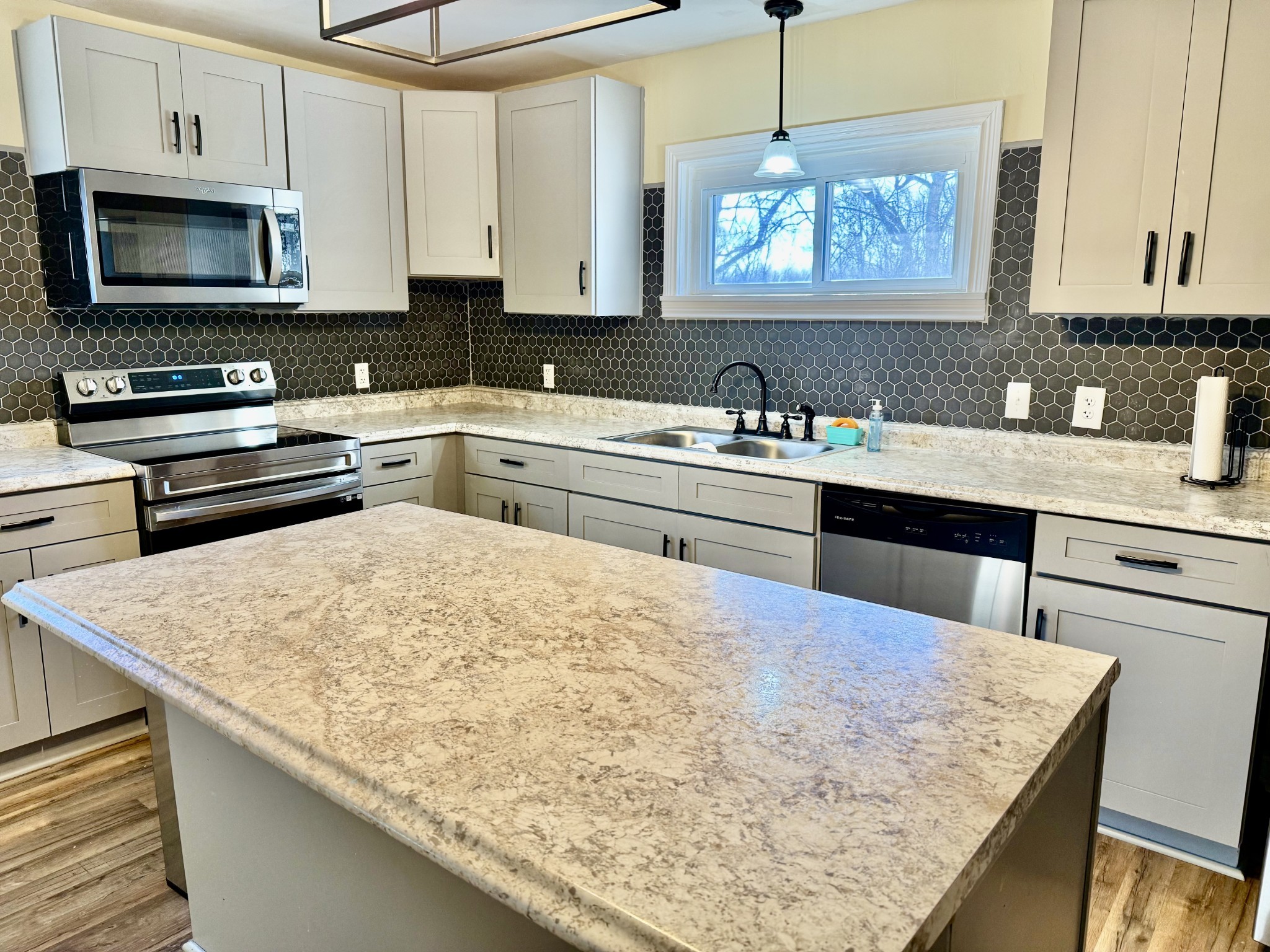 1499 North Liberty Church Road Clarksville, TN 37042 - Photo 2 of 9 a kitchen with a stove a sink and a microwave