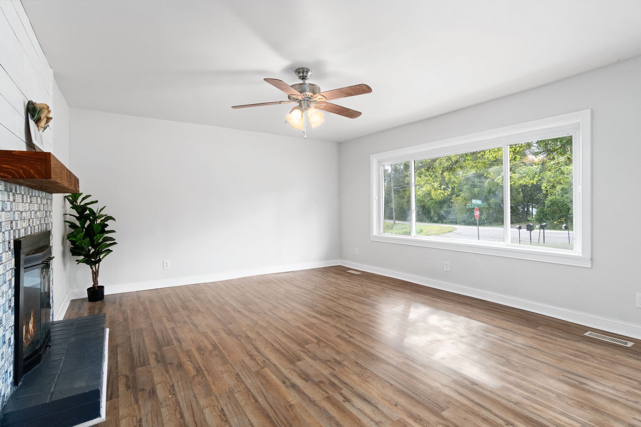 1499 North Liberty Church Road Clarksville, TN 37042 - Photo 4 of 9 wooden floor in an empty room with a window