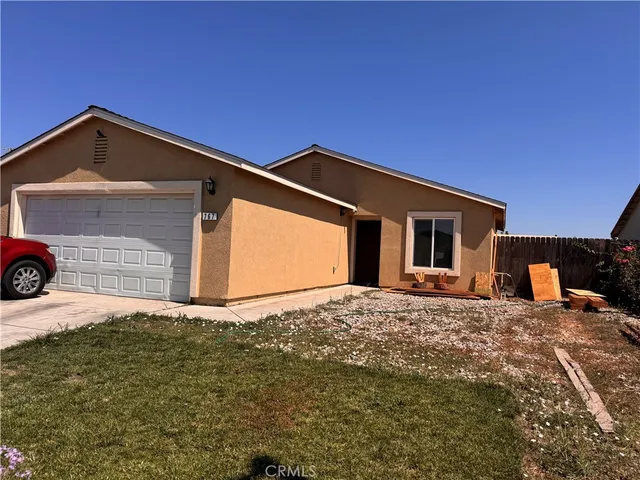 a backyard of a house with garage