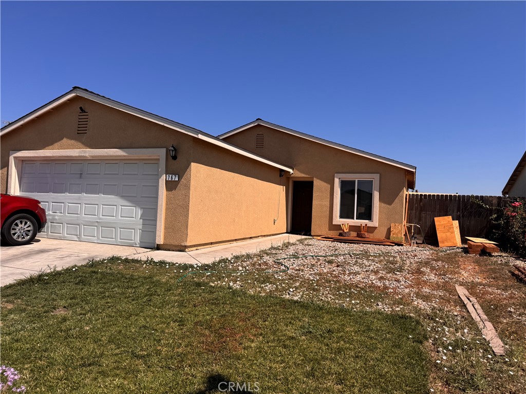 767 Taryn Court Merced, CA 95341 - Photo 1 of 1 a backyard of a house with garage