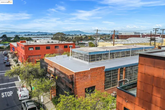 an aerial view of a building with an outdoor space