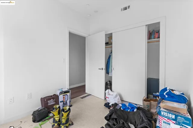 a buildings with car parked in front of it