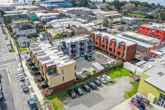 a front view of a residential apartment building with a yard