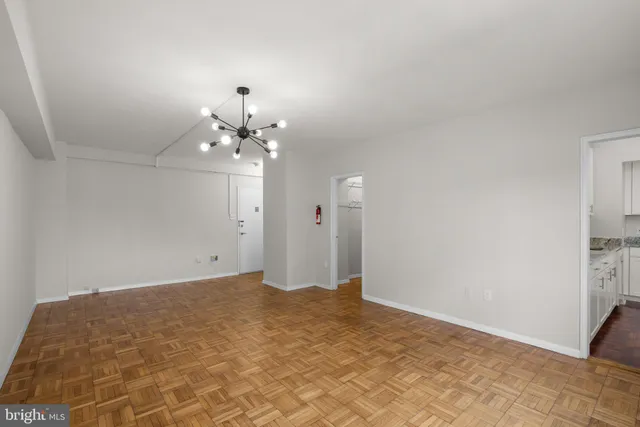 a view of a chandelier in an empty room