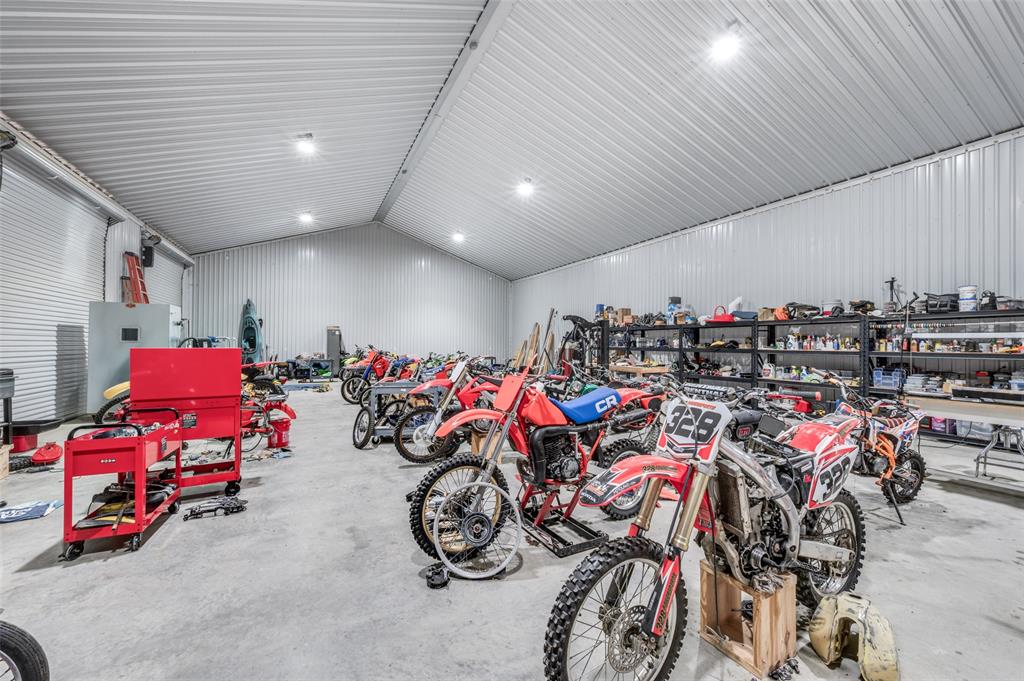 5165 Hartlee Field Road Denton, TX 76208 - Photo 16 of 39 a view of a garage with a bike and car