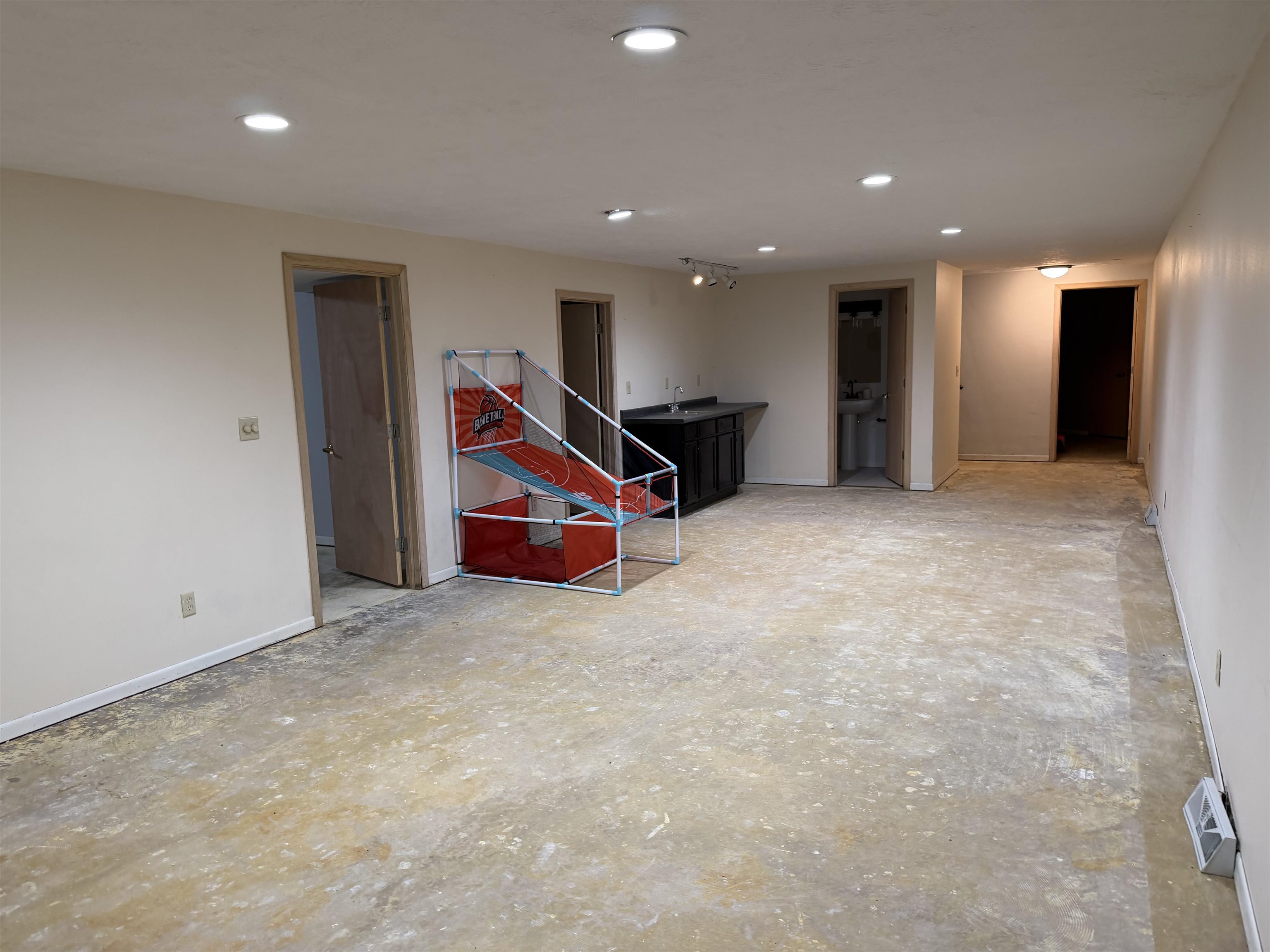 6432 Spring Hill Close Rockford, IL 61108 - Photo 3 of 13 an empty room with furniture and air hockey table
