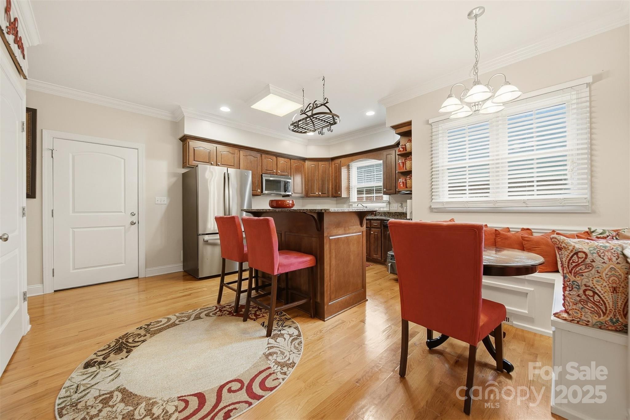 1710 30th Ave Drive Northeast Hickory, NC 28601 - Photo 12 of 44 a dining room with wooden floor and a chandelier