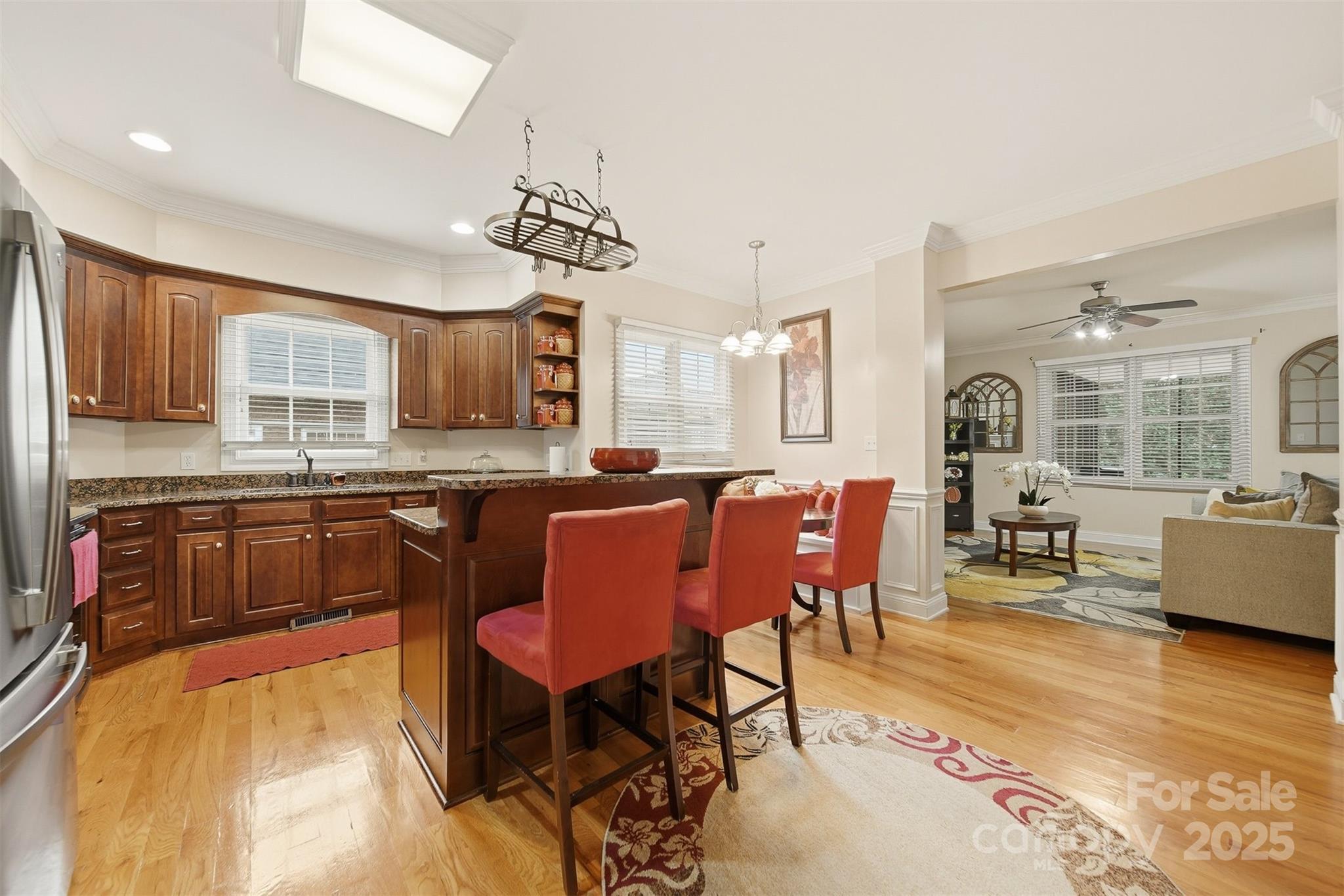 1710 30th Ave Drive Northeast Hickory, NC 28601 - Photo 13 of 44 a large kitchen with a table chairs wooden cabinets and appliances