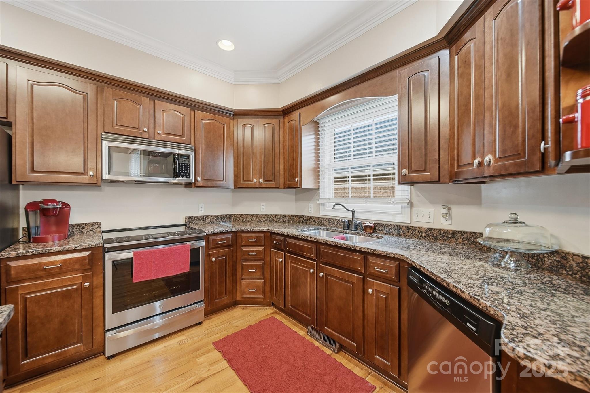 1710 30th Ave Drive Northeast Hickory, NC 28601 - Photo 15 of 44 a kitchen with stainless steel appliances granite countertop wooden cabinets a sink and dishwasher