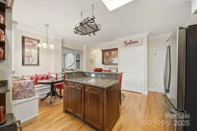 a kitchen with a stove and a refrigerator