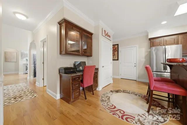 a workspace with furniture and wooden floor