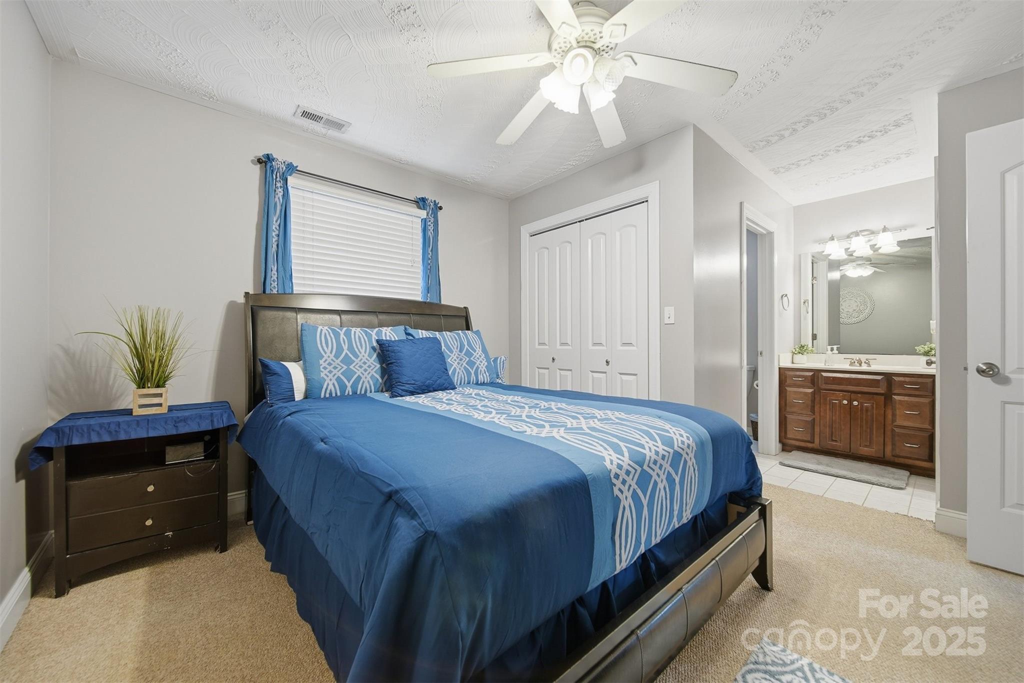 1710 30th Ave Drive Northeast Hickory, NC 28601 - Photo 29 of 44 a bedroom with a bed and a chandelier