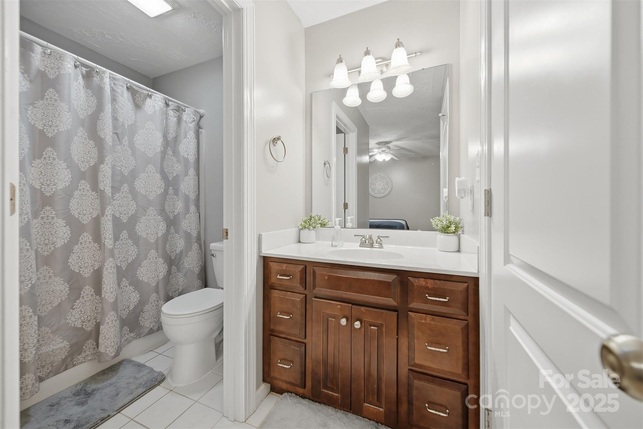 1710 30th Ave Drive Northeast Hickory, NC 28601 - Photo 30 of 44 a bathroom with a double vanity sink mirror and toilet