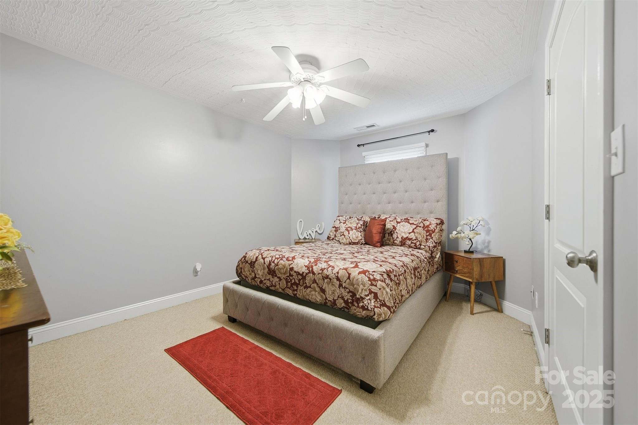 1710 30th Ave Drive Northeast Hickory, NC 28601 - Photo 31 of 44 a bedroom with a bed and a chandelier