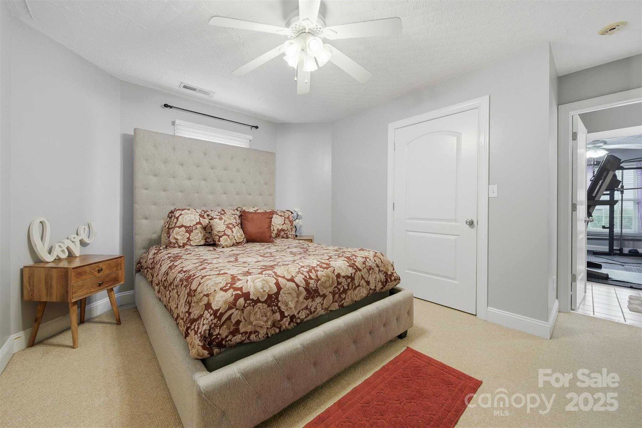 1710 30th Ave Drive Northeast Hickory, NC 28601 - Photo 32 of 44 a bedroom with a bed and a chandelier