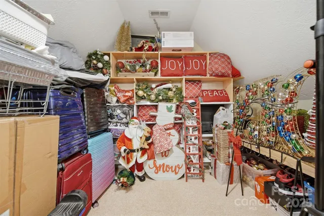 a bedroom with furniture and a floor to ceiling window