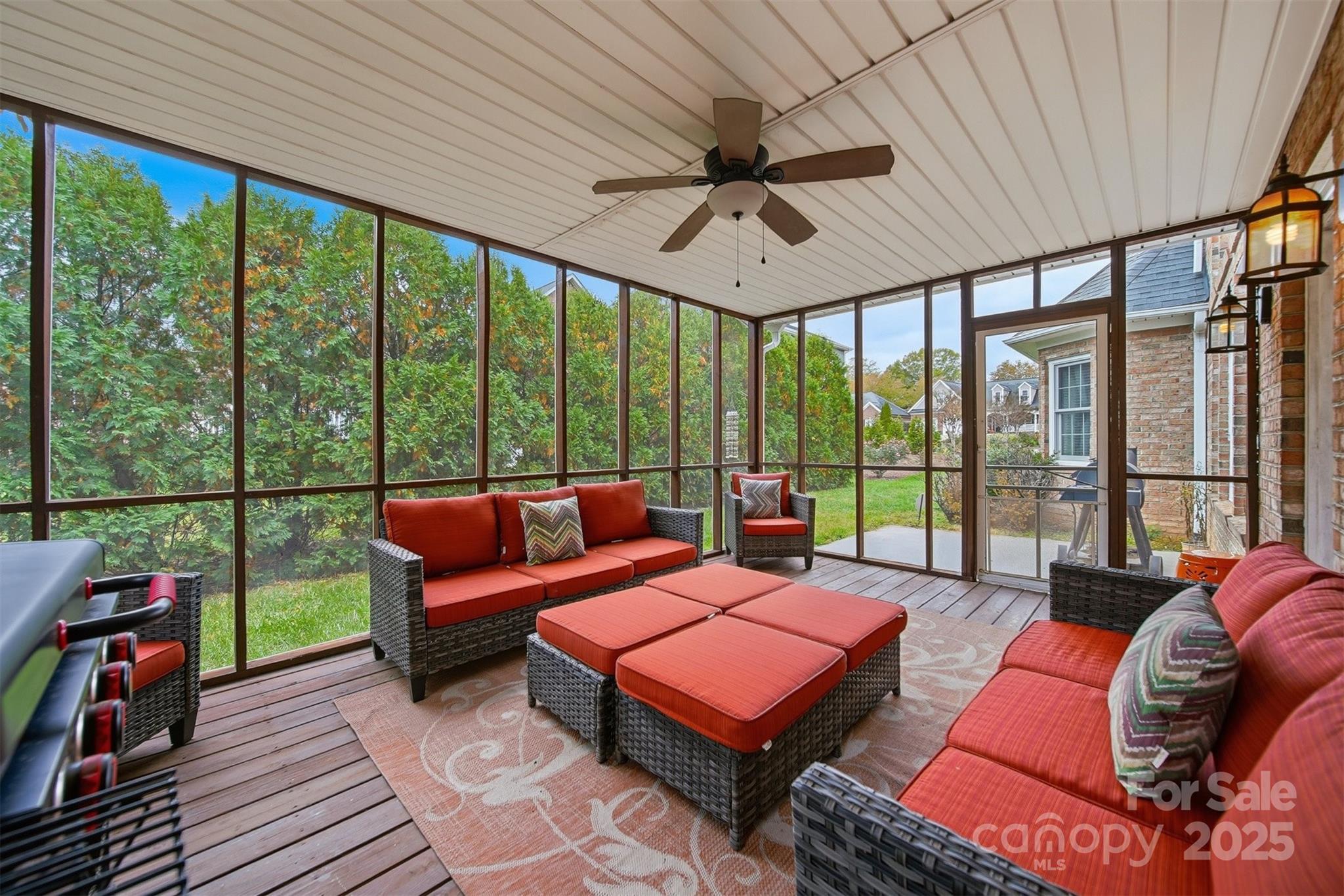 1710 30th Ave Drive Northeast Hickory, NC 28601 - Photo 39 of 44 a living room with furniture a ceiling fan and a floor to ceiling window