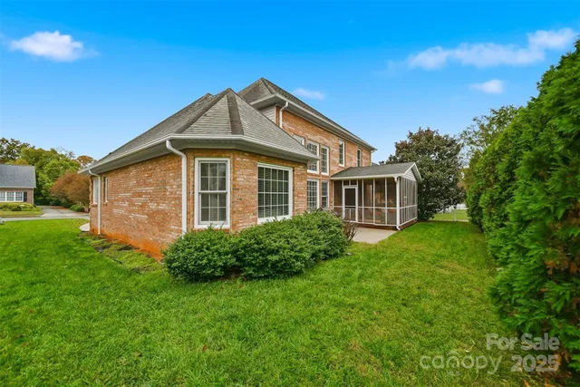 a view of a house with backyard sitting area and garden