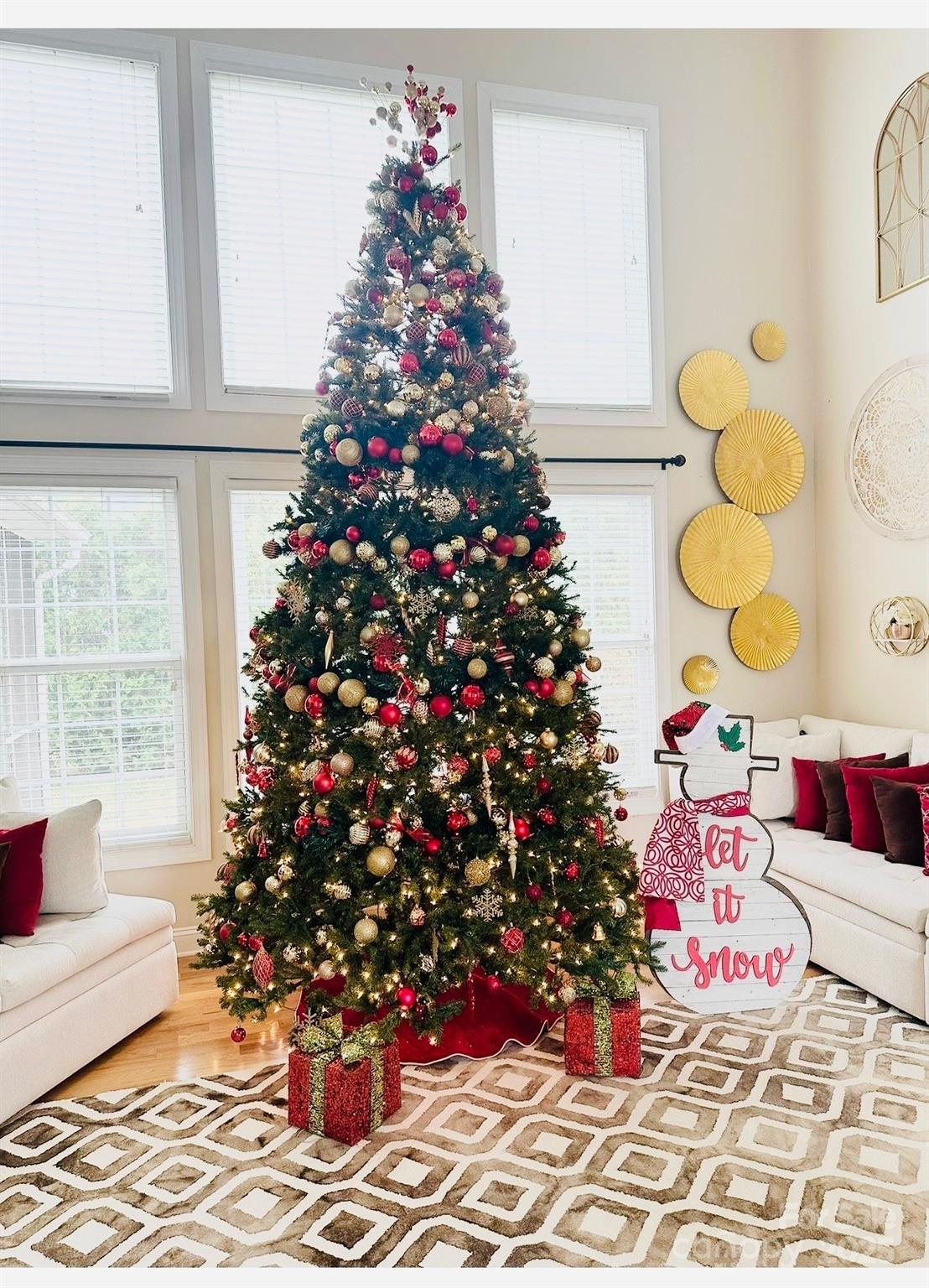 1710 30th Ave Drive Northeast Hickory, NC 28601 - Photo 10 of 44 a vase of flowers sitting on a floor in front of a window