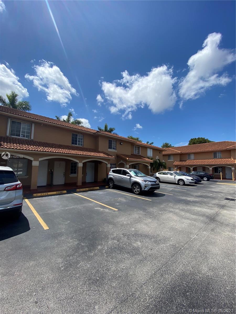 3526 West 76th Street, Unit 203 Hialeah, FL 33018 - Photo 2 of 30 a view of a car parked in front of a building