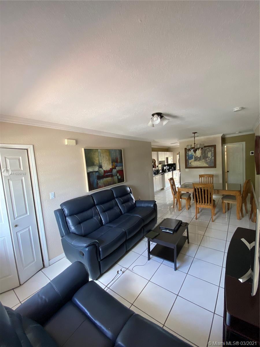 3526 West 76th Street, Unit 203 Hialeah, FL 33018 - Photo 12 of 30 a living room with furniture