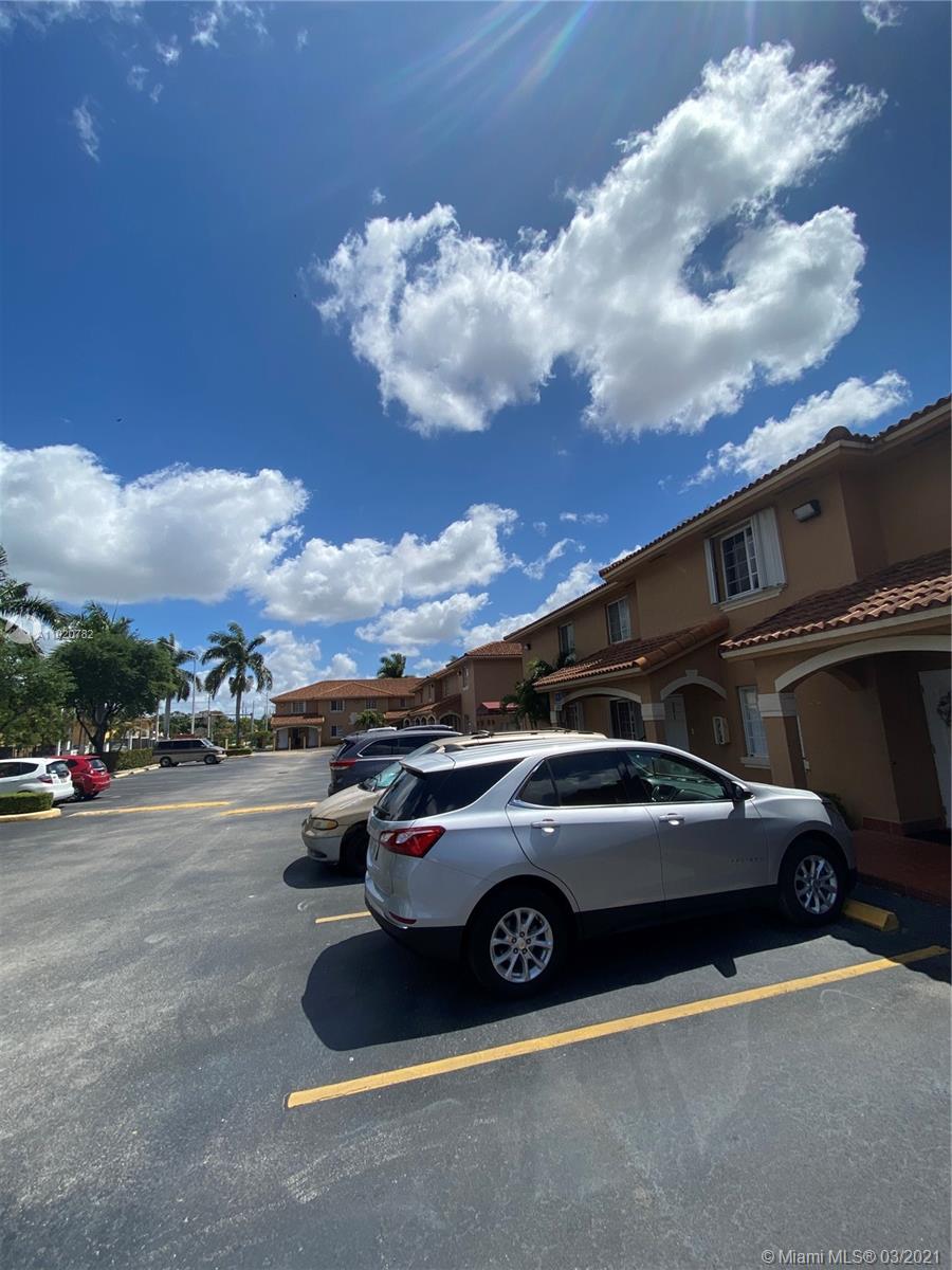 3526 West 76th Street, Unit 203 Hialeah, FL 33018 - Photo 3 of 30 a view of a car parked in the parking lot