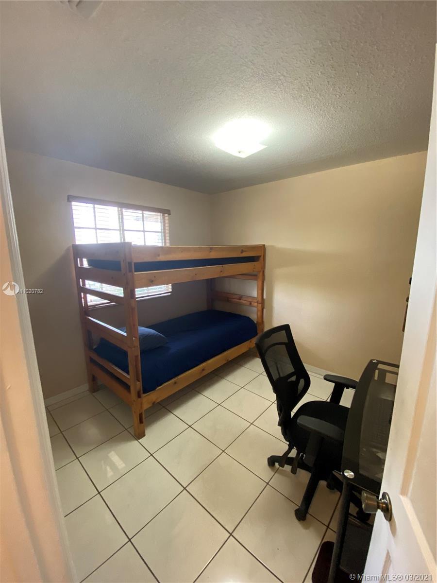 3526 West 76th Street, Unit 203 Hialeah, FL 33018 - Photo 24 of 30 a view of a room with gym equipment