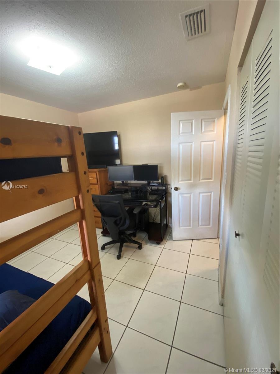 3526 West 76th Street, Unit 203 Hialeah, FL 33018 - Photo 25 of 30 a living room with furniture