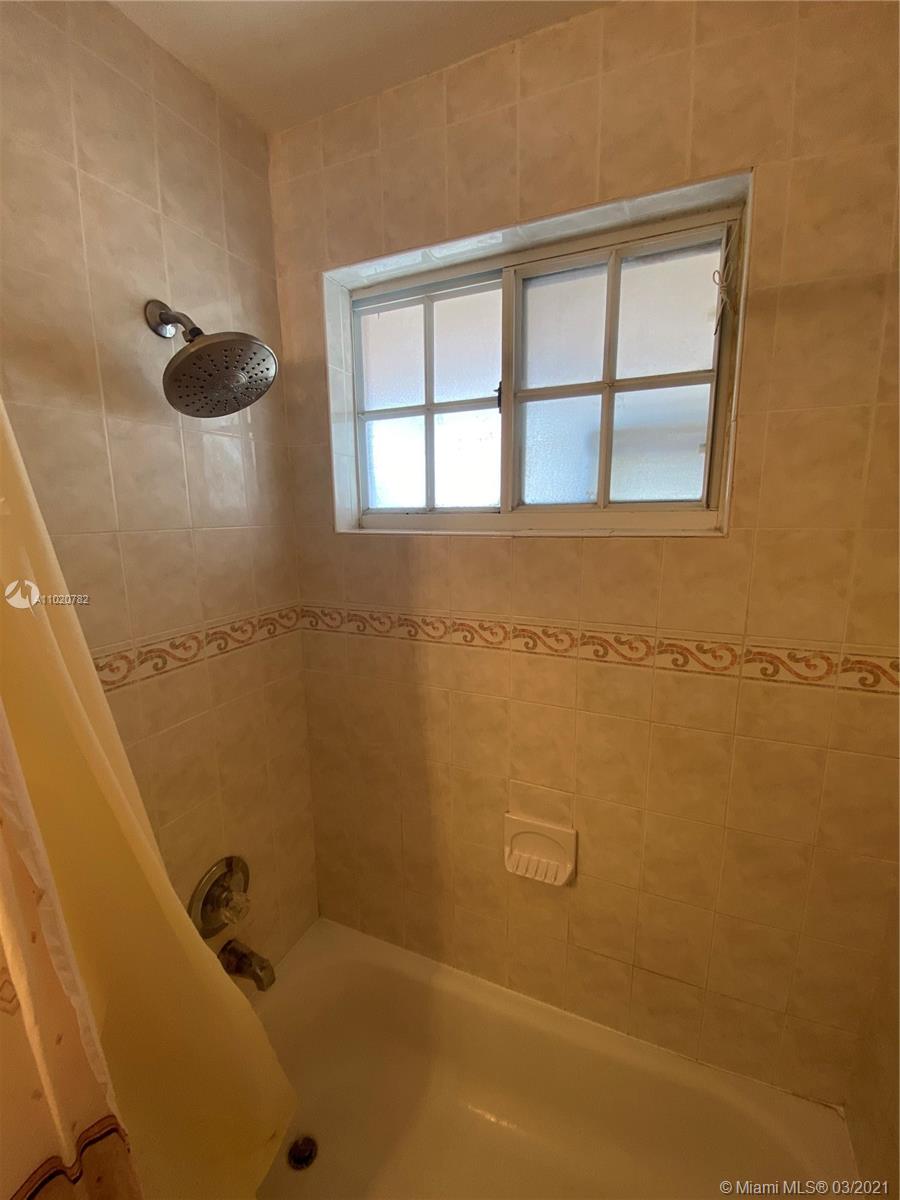 3526 West 76th Street, Unit 203 Hialeah, FL 33018 - Photo 28 of 30 a bathroom with a tub