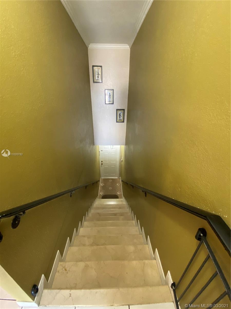 3526 West 76th Street, Unit 203 Hialeah, FL 33018 - Photo 5 of 30 a view of a hall with wooden floor