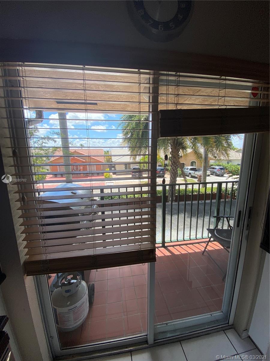 3526 West 76th Street, Unit 203 Hialeah, FL 33018 - Photo 7 of 30 a view of a from a balcony