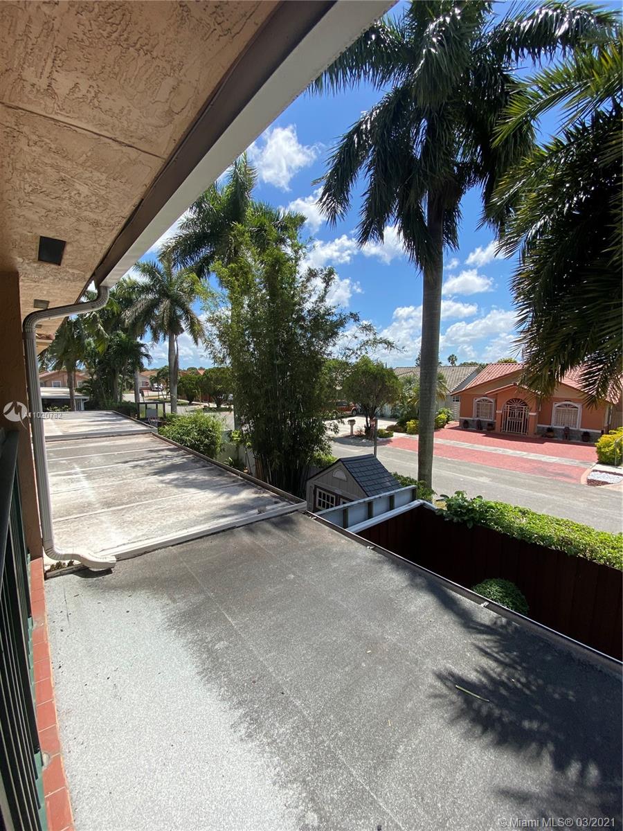 3526 West 76th Street, Unit 203 Hialeah, FL 33018 - Photo 9 of 30 a view of a street with a building in the background