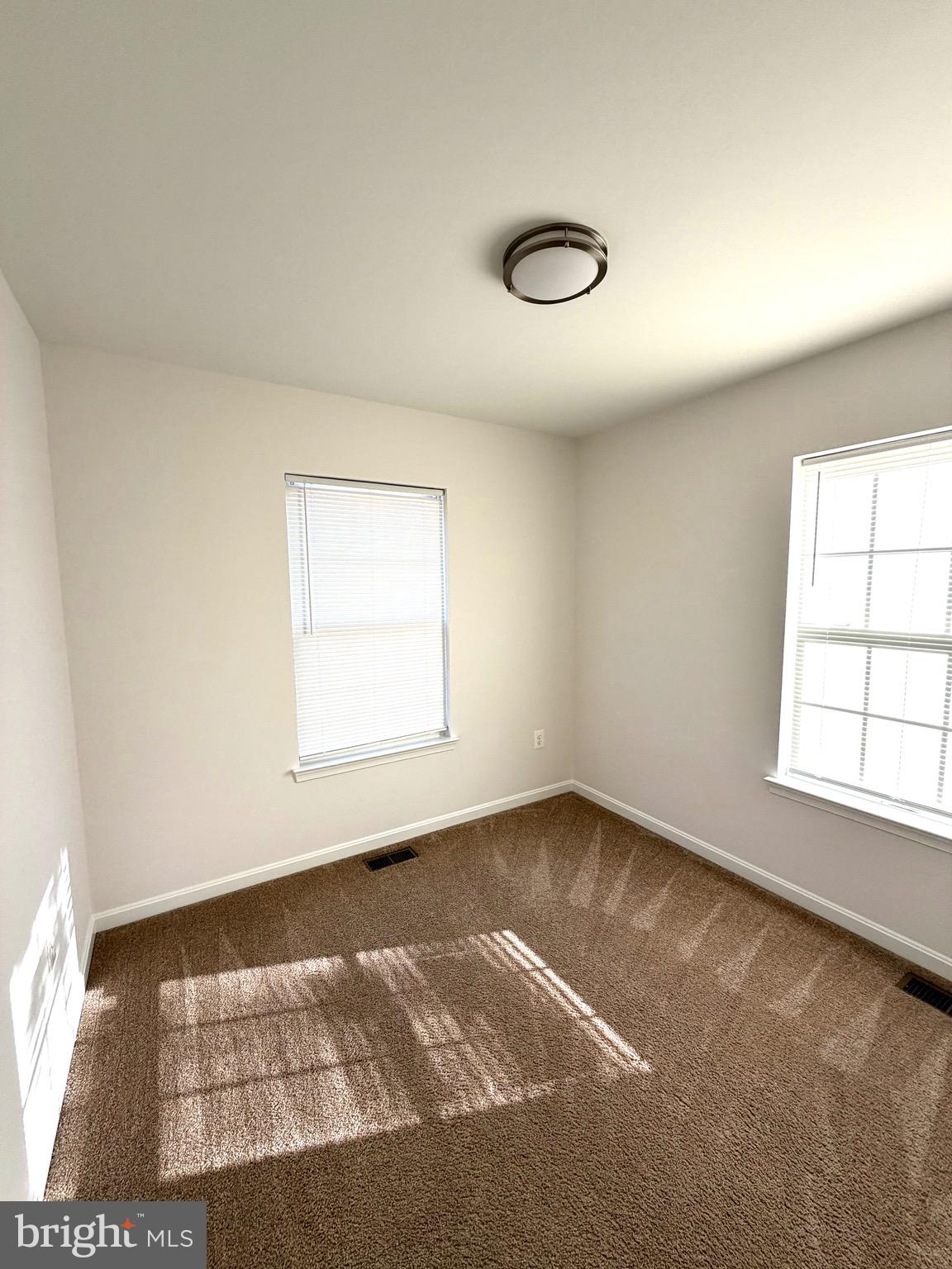 107 A Burck Street, Unit A Frederick, MD 21701 - Photo 16 of 22 an empty room with a window