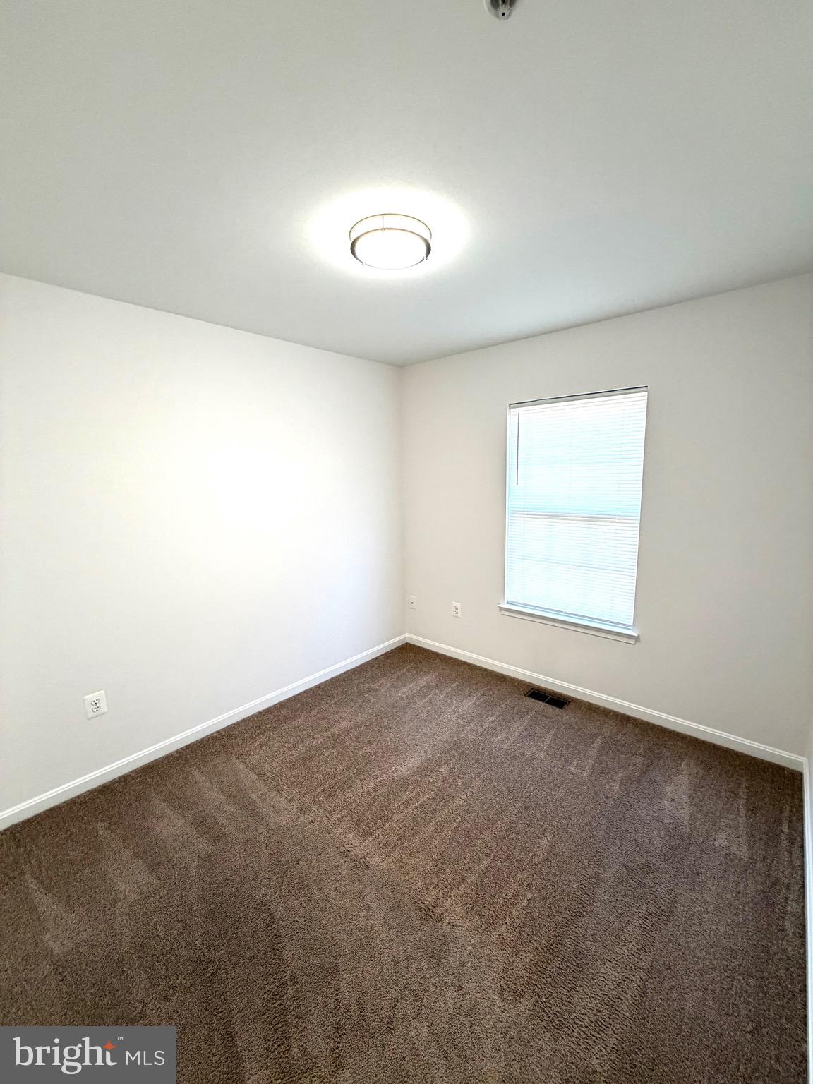 107 A Burck Street, Unit A Frederick, MD 21701 - Photo 17 of 22 an empty room with a empty space and windows