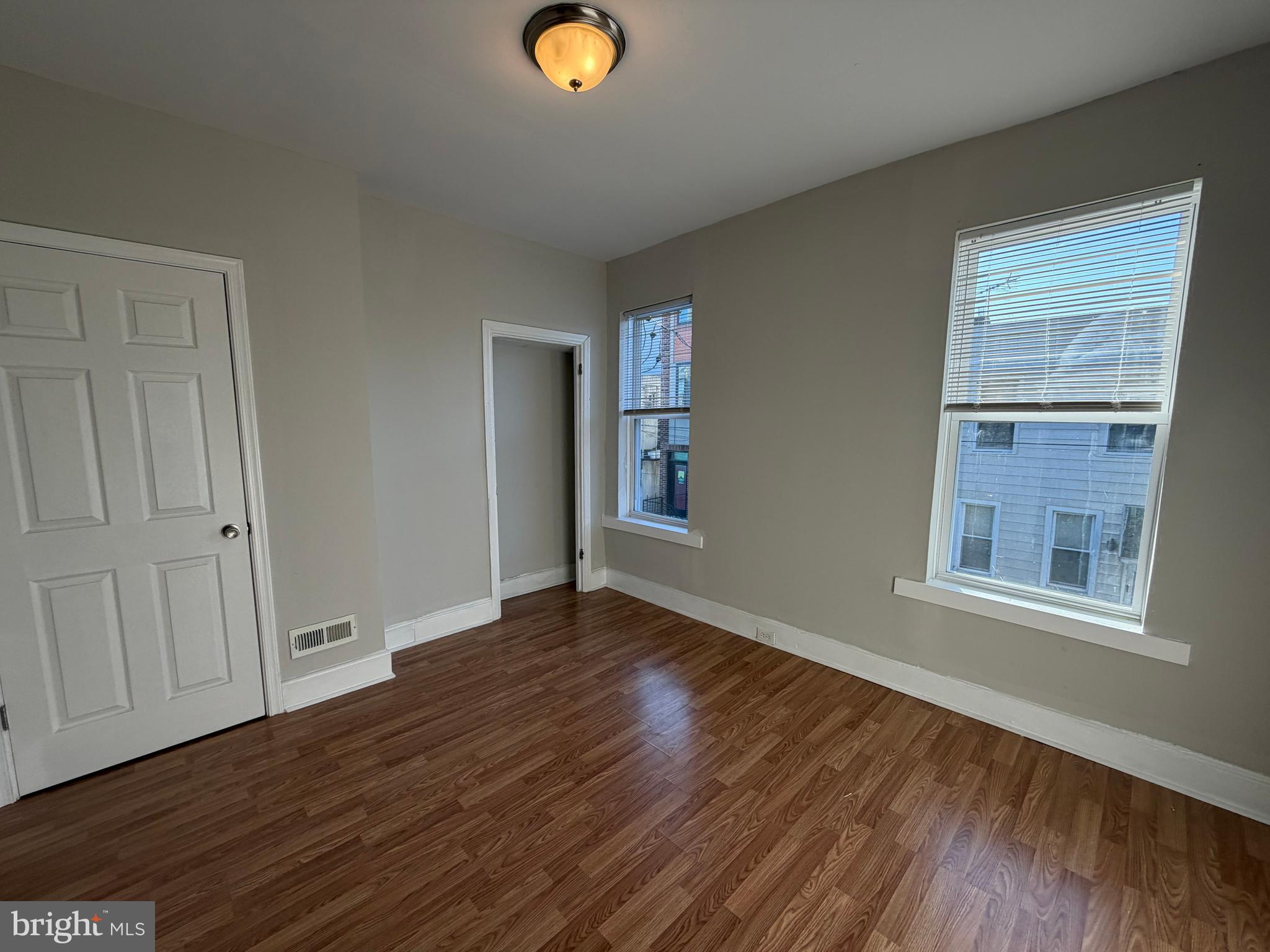 2015 Fernon Street Philadelphia, PA 19145 - Photo 21 of 24 a view of an empty room with wooden floor and a window