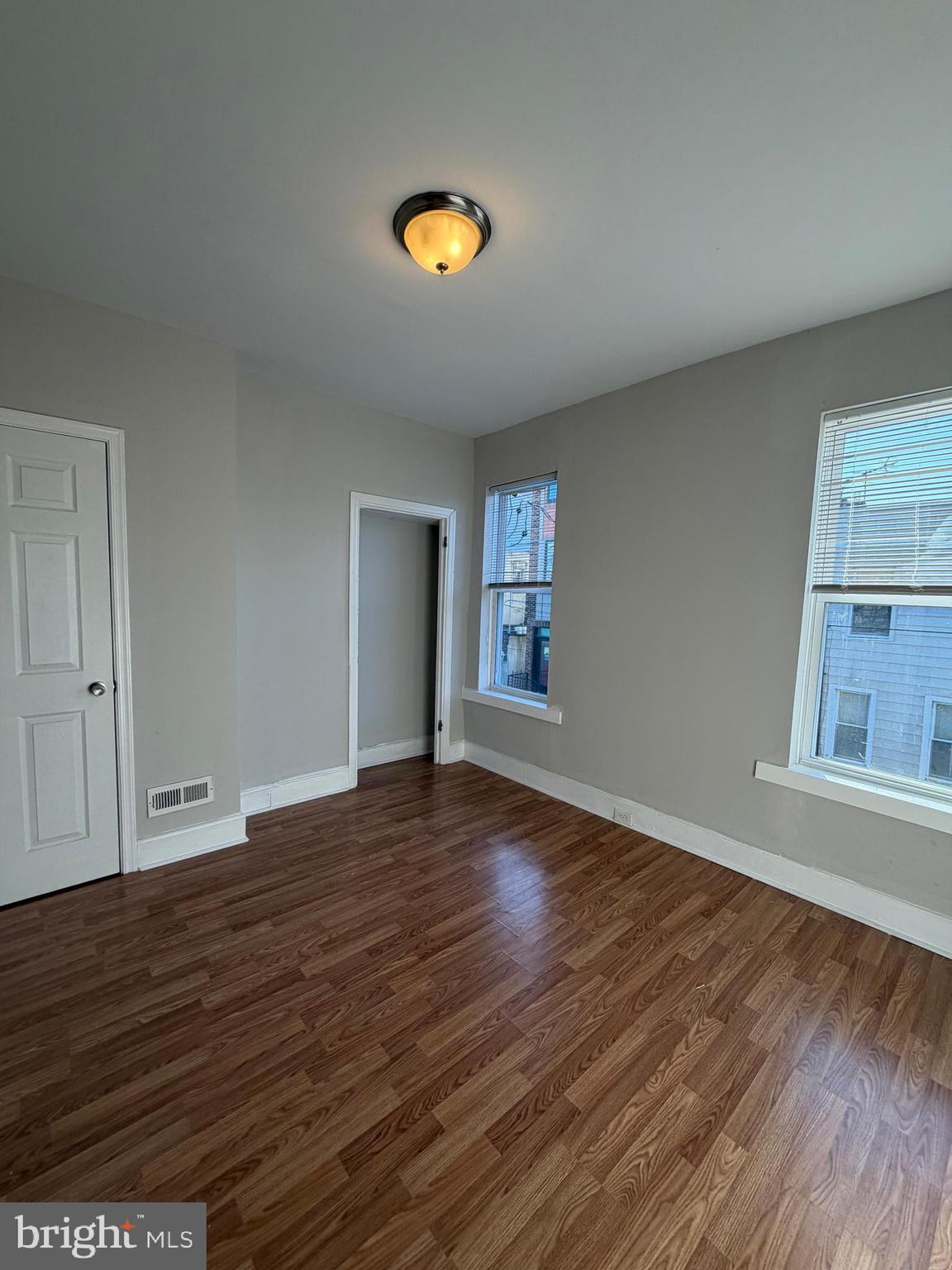 2015 Fernon Street Philadelphia, PA 19145 - Photo 22 of 24 a view of an empty room with wooden floor and a window