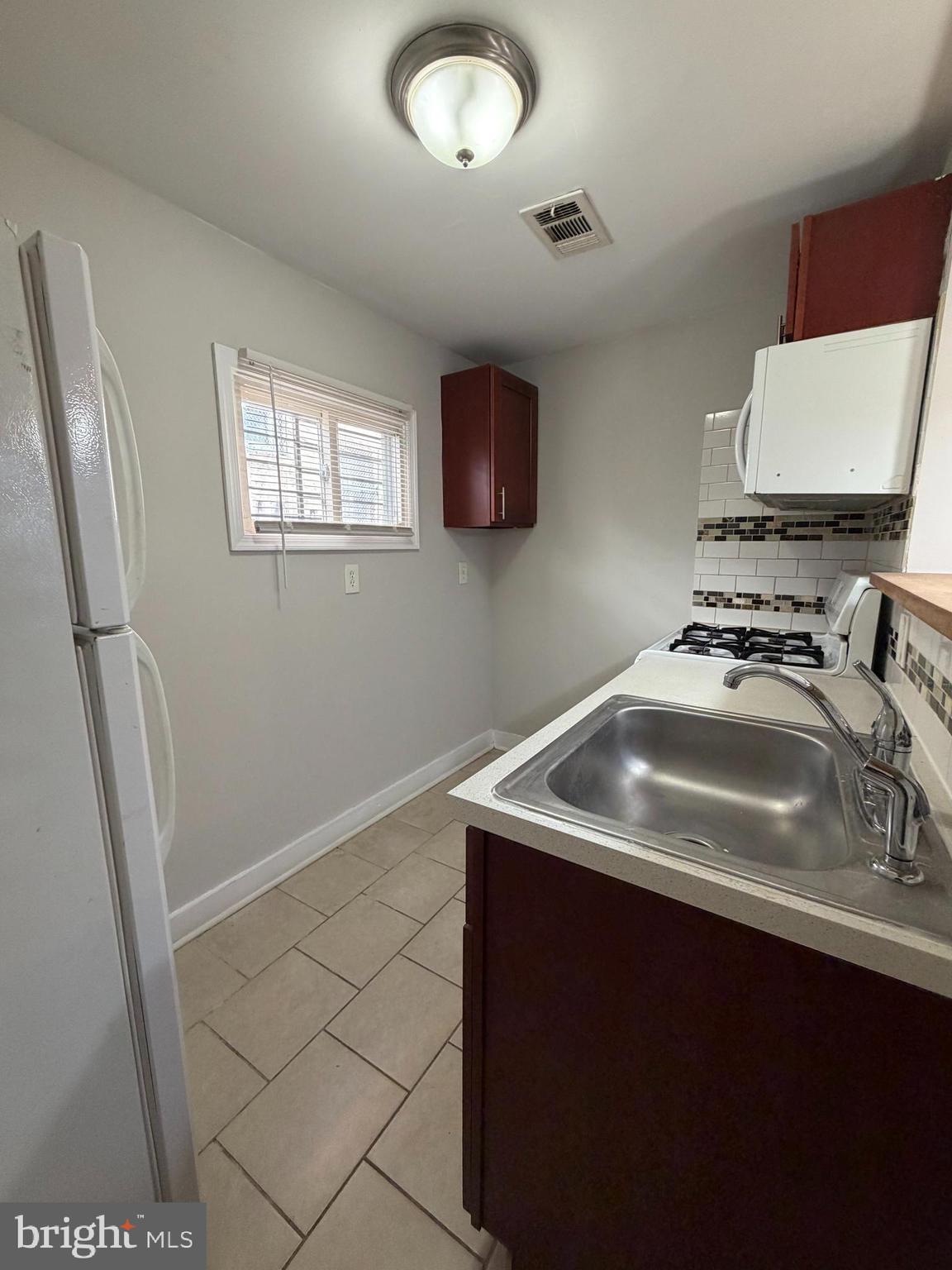 2015 Fernon Street Philadelphia, PA 19145 - Photo 8 of 24 a bathroom with a sink a vanity and a mirror