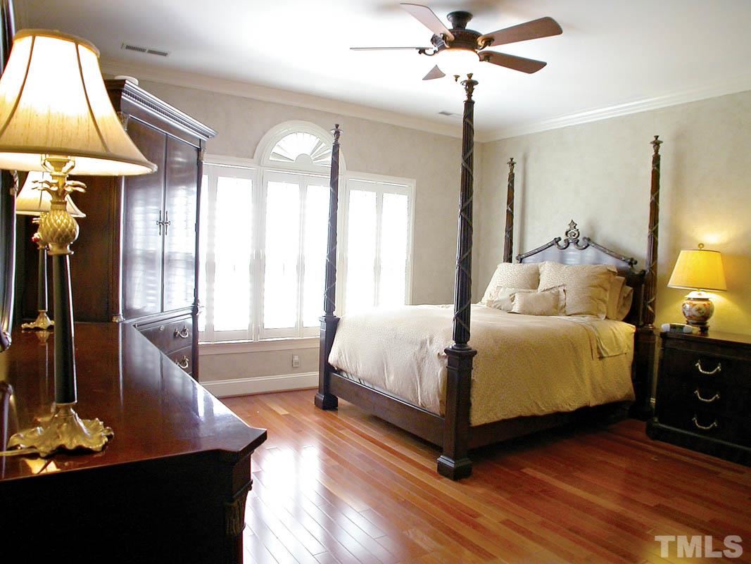 12200 Lockhart Lane Raleigh, NC 27614 - Photo 13 of 25 1st floor guest bedroom with an ensuite bath. Double door entry with rich, warm rosewood floors, large walk-in closet and beautiful windows ensuring every guest feels at home.