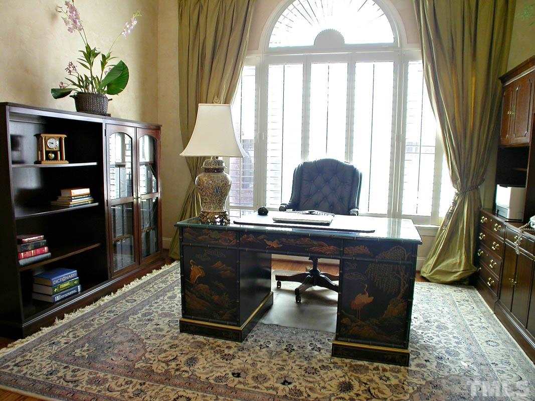 12200 Lockhart Lane Raleigh, NC 27614 - Photo 16 of 25 French glass pocket doors open to the richly designed study with handcrafted faux leather trey ceiling, unveiling a poetic view of the exquisite dining room.