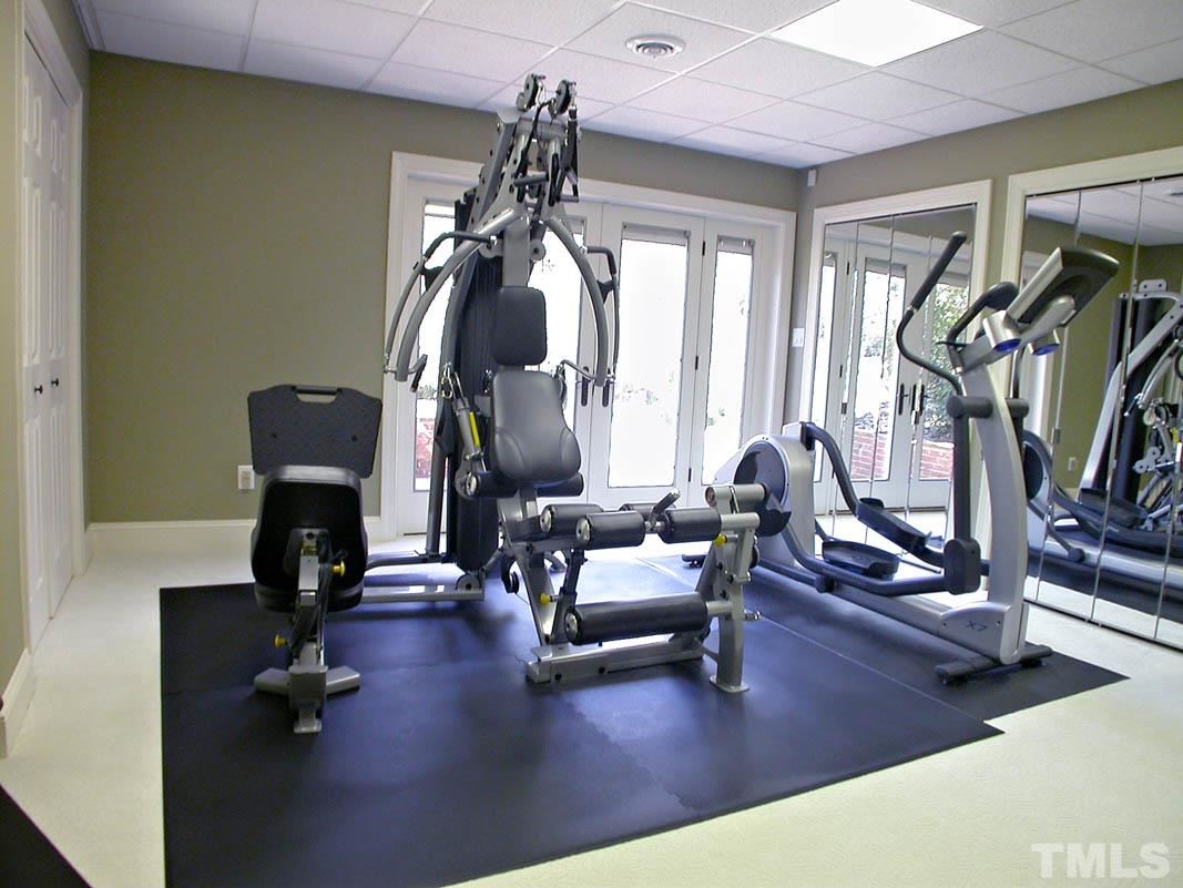 12200 Lockhart Lane Raleigh, NC 27614 - Photo 24 of 25 Utilized as an exercise room, this space has large closets and walk-out access to the backyard!