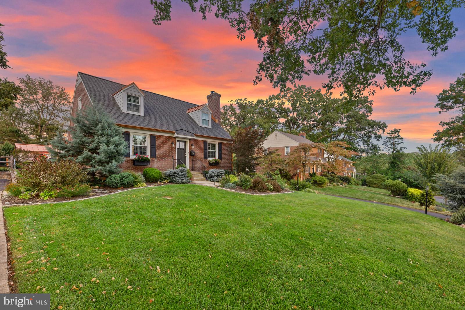 Charming home under a vibrant sunset.